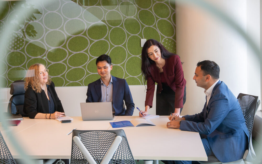 Photo of people sitting around a table.