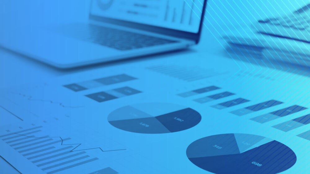 Decorative photo of papers with graphs.