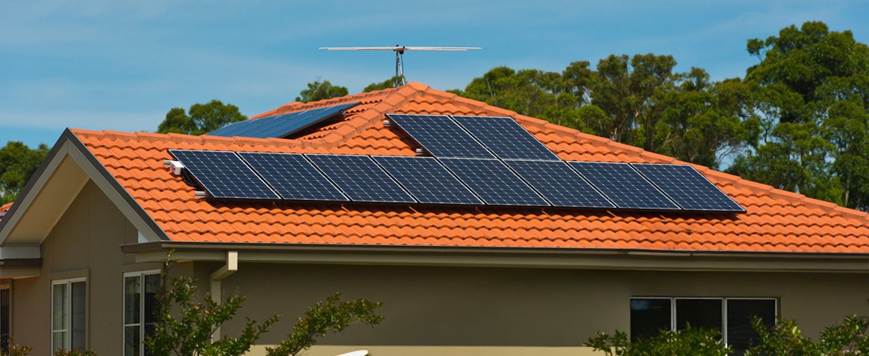 Photo of a house roof with solar panels.